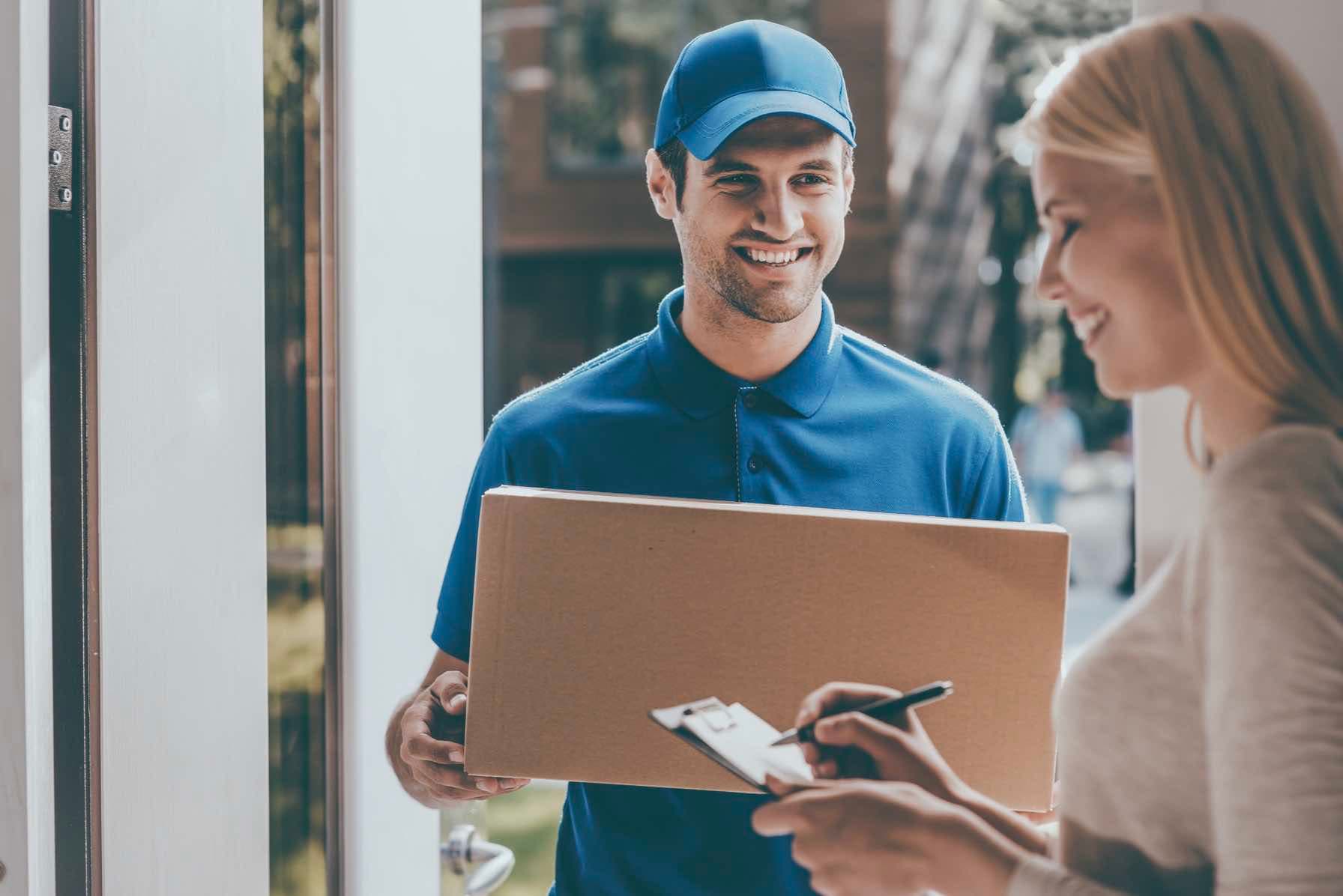 Woman signing for a package.